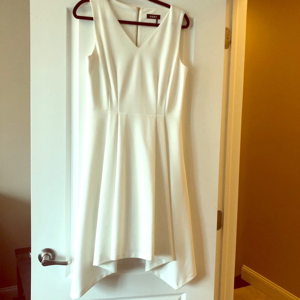 DKNY white sleeveless v-neck pleated dress.